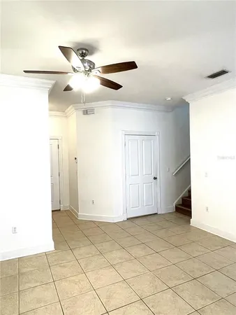 a kitchen with a sink a stove top oven and cabinets