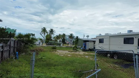 a view of a park with swings and slides