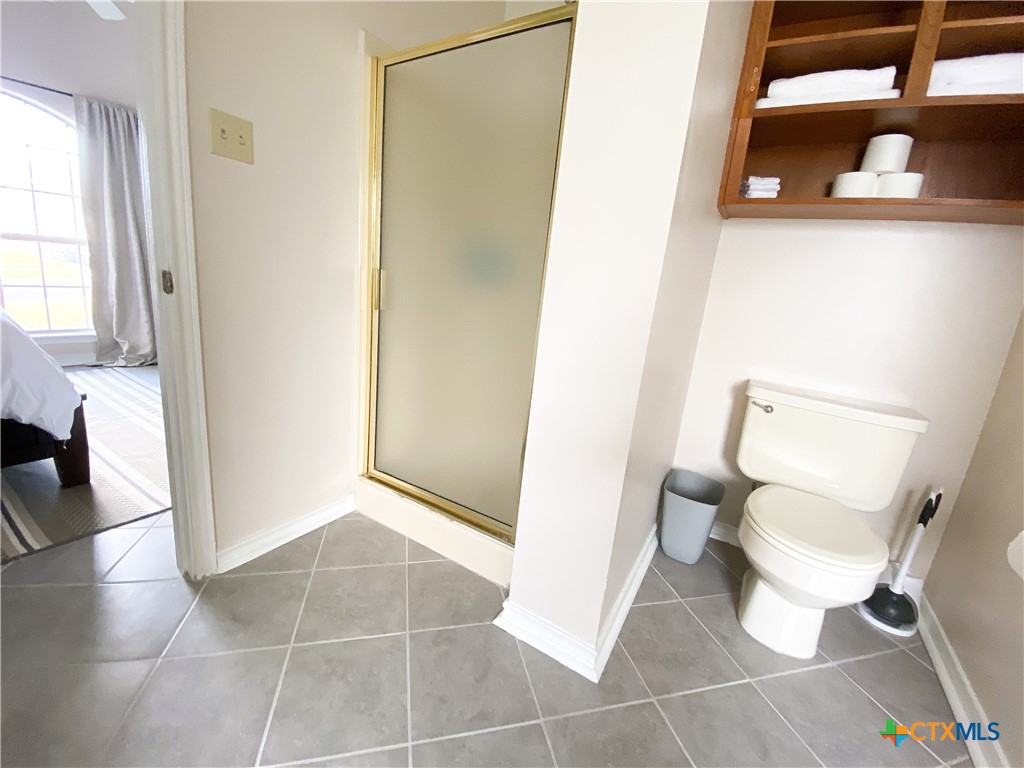 2703 Larkspur Drive Killeen, TX 76549 - Photo 12 of 17 a bathroom with a toilet and a shower