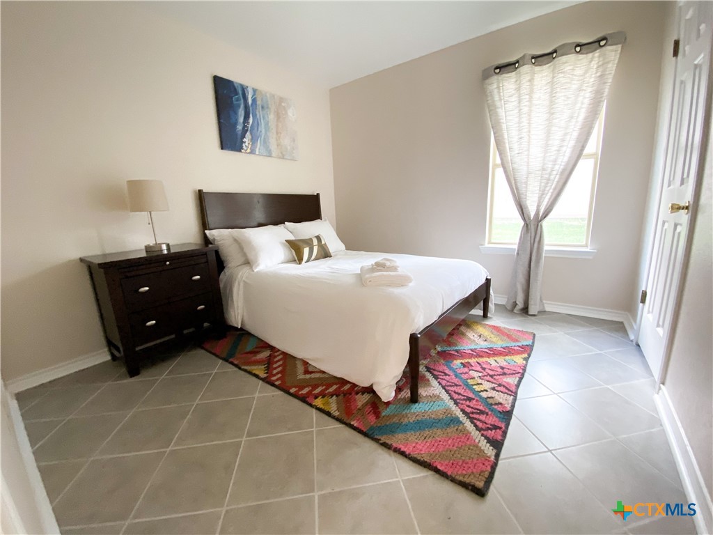 2703 Larkspur Drive Killeen, TX 76549 - Photo 14 of 17 a bedroom with a bed and a window in it