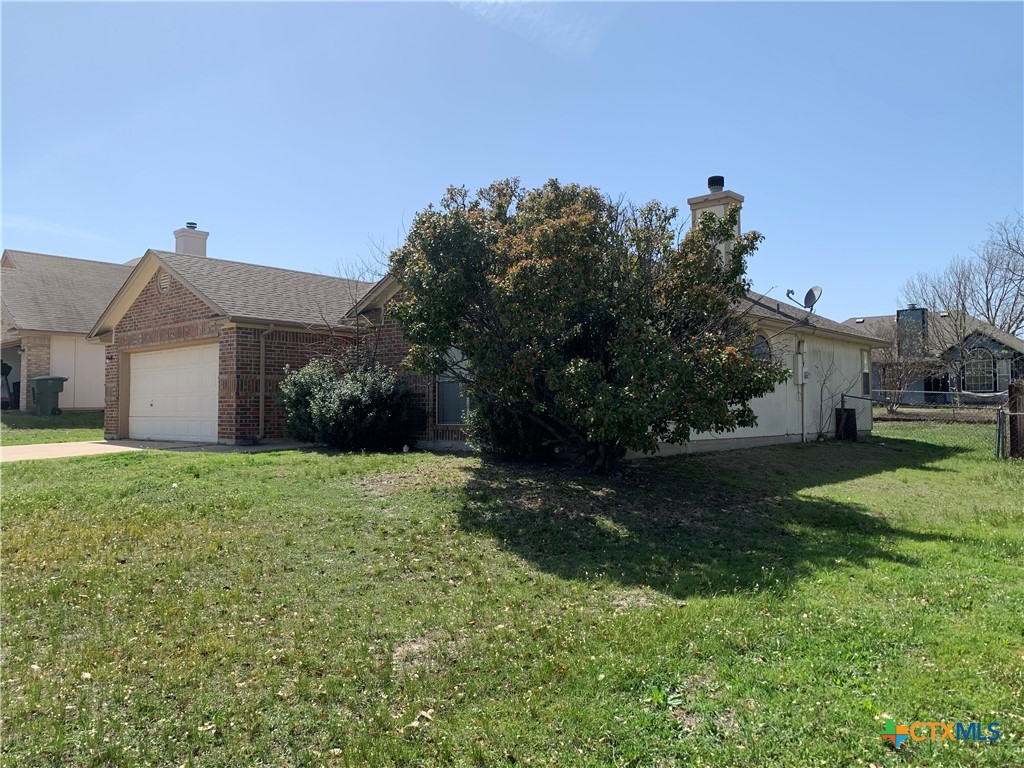 2703 Larkspur Drive Killeen, TX 76549 - Photo 17 of 17 a view of a house with yard and a garden
