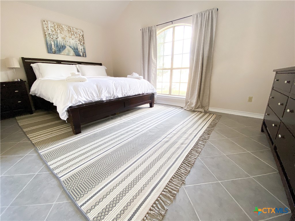 2703 Larkspur Drive Killeen, TX 76549 - Photo 9 of 17 a spacious bedroom with a bed and a window