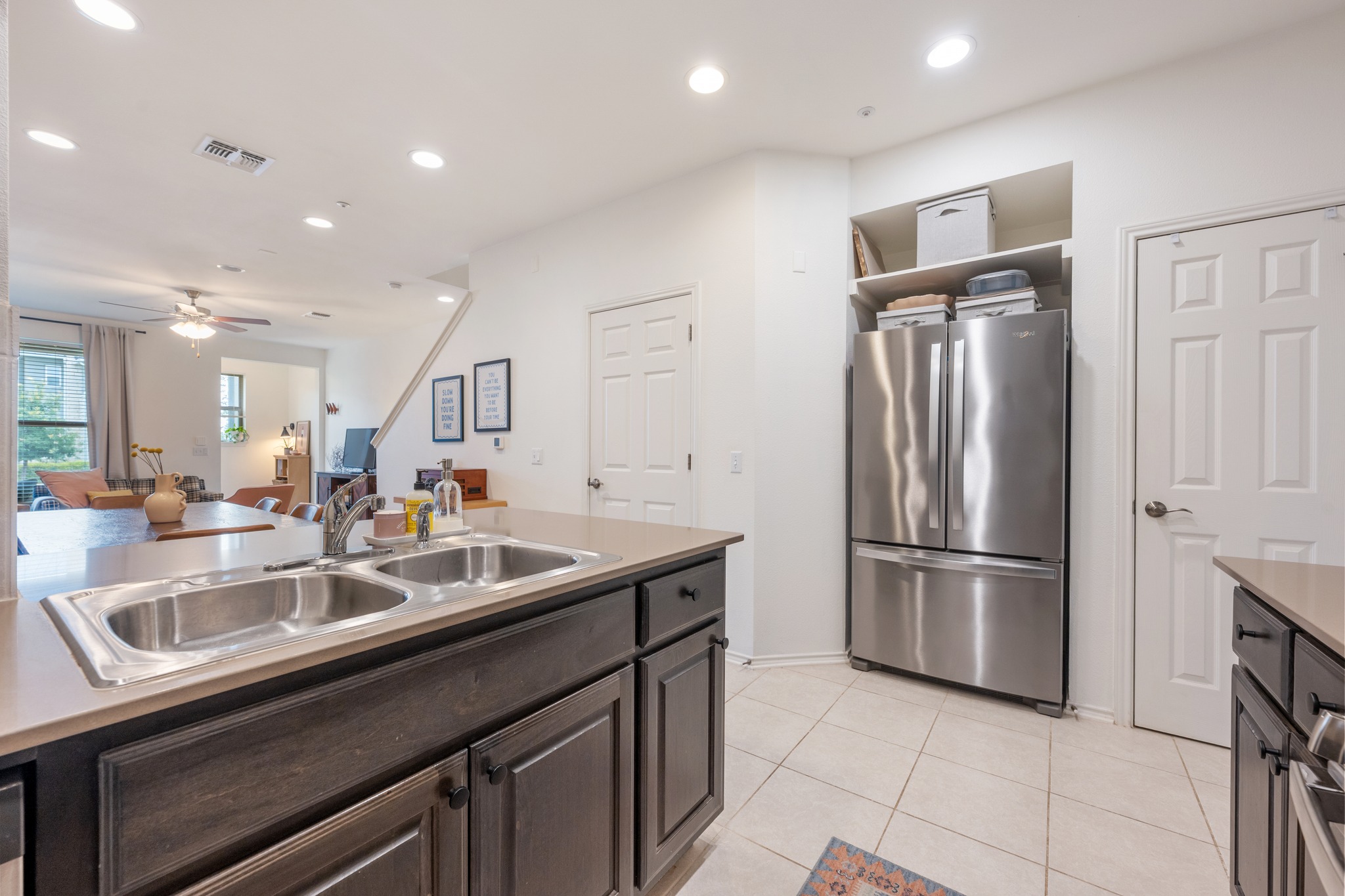 4400 Vaughan Street, Unit B Austin, TX 78723 - Photo 13 of 29 a kitchen with kitchen island a sink and refrigerator