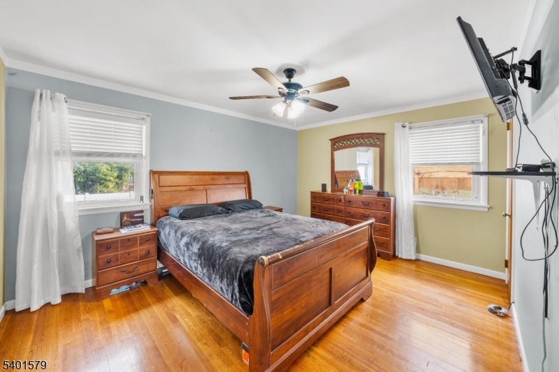 2563 Jackson Avenue Union, NJ 07083 - Photo 18 of 39 a bedroom with a bed and a chandelier
