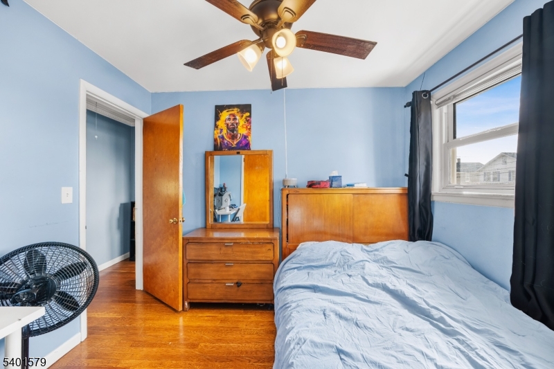 2563 Jackson Avenue Union, NJ 07083 - Photo 22 of 39 a bedroom with a bed and wooden floor