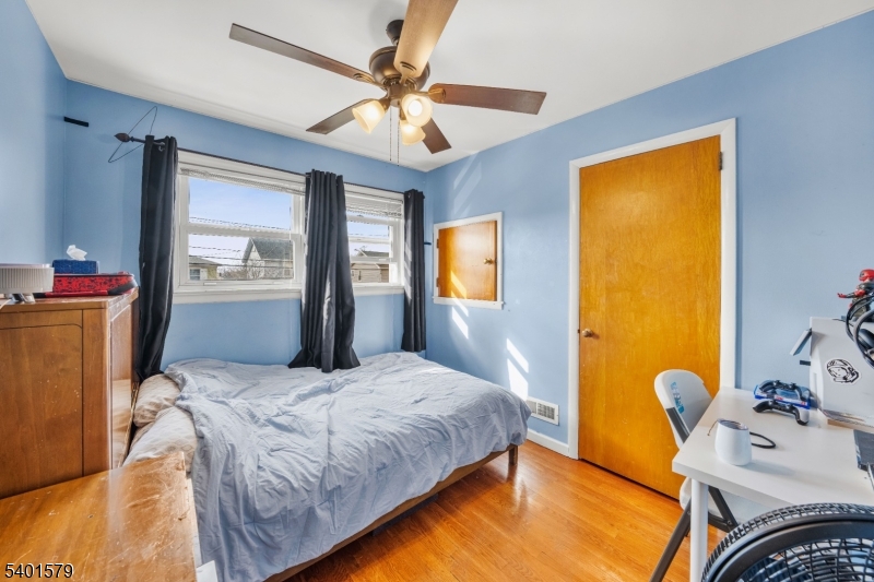 2563 Jackson Avenue Union, NJ 07083 - Photo 23 of 39 a bedroom with a bed dresser and a window