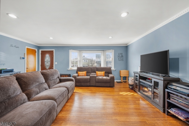 2563 Jackson Avenue Union, NJ 07083 - Photo 3 of 39 a living room with furniture and a flat screen tv