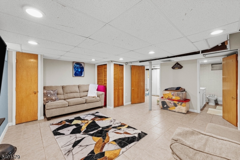 2563 Jackson Avenue Union, NJ 07083 - Photo 32 of 39 a living room with furniture and a large window