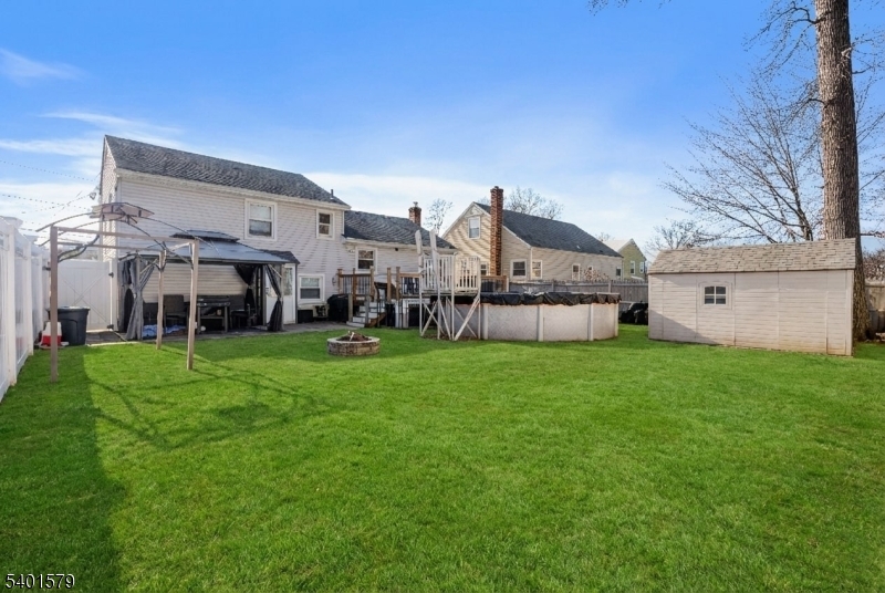 2563 Jackson Avenue Union, NJ 07083 - Photo 35 of 39 a view of a house with a big yard and large trees
