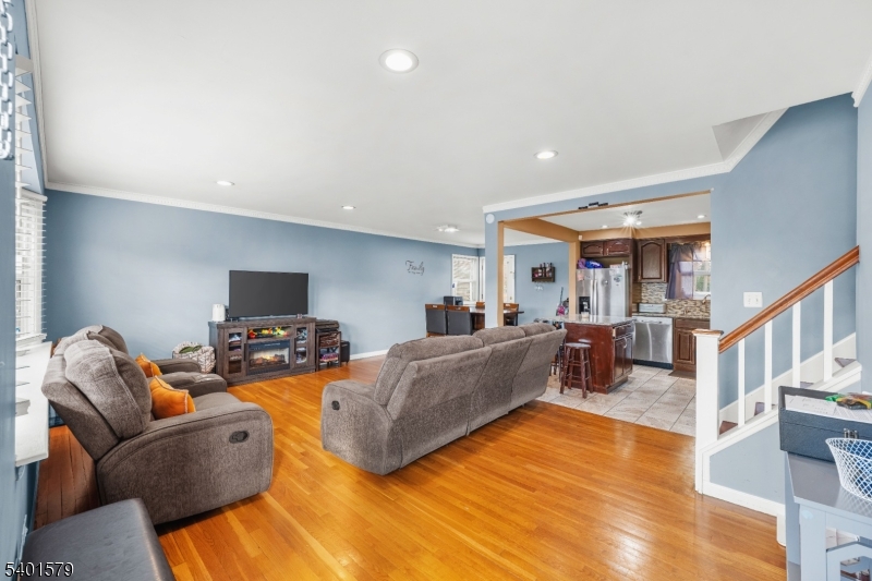 2563 Jackson Avenue Union, NJ 07083 - Photo 6 of 39 a living room with furniture and a flat screen tv