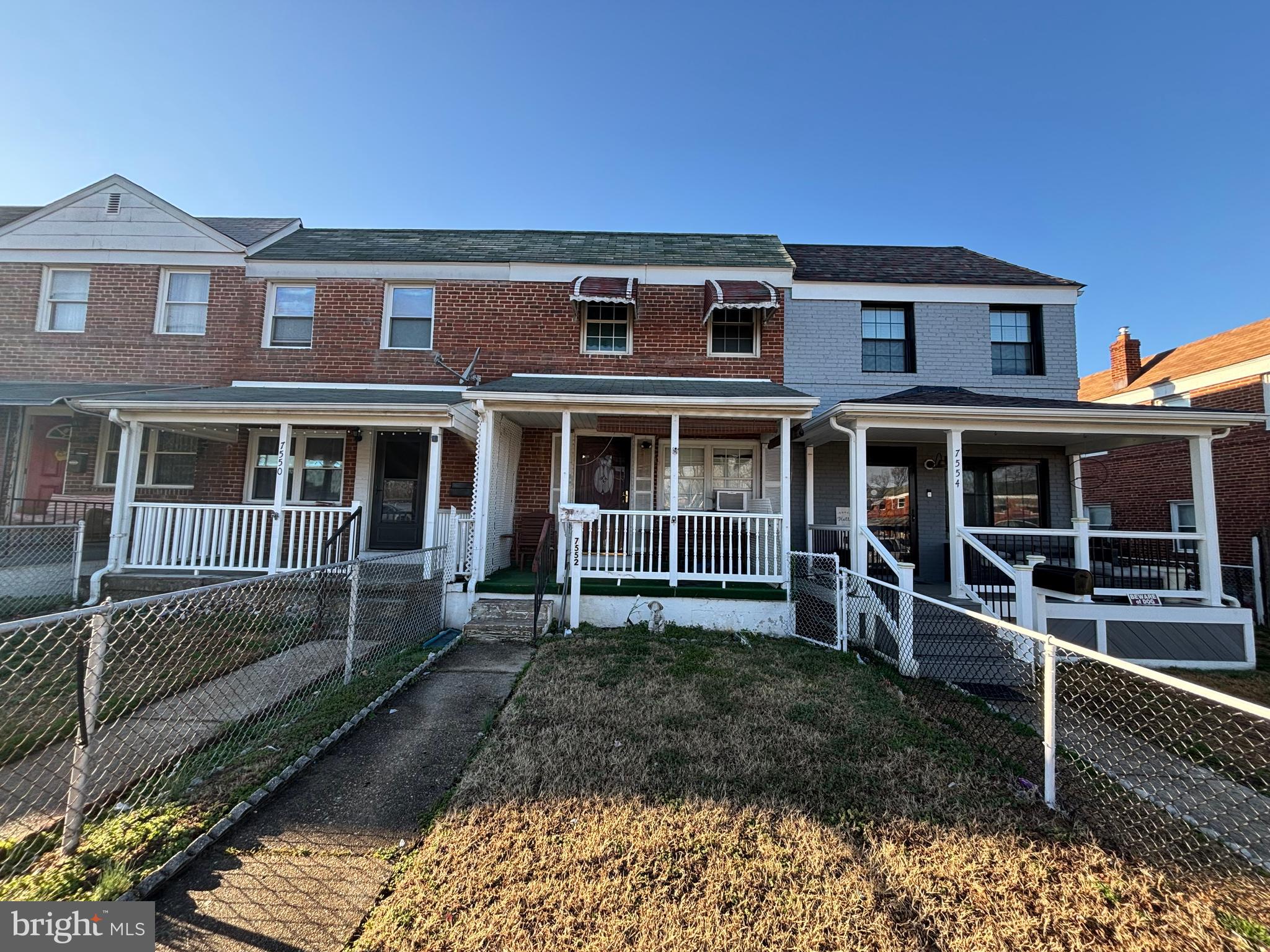 7552 Rabon Avenue Baltimore, MD 21222 - Photo 1 of 39 a front view of a house with yard