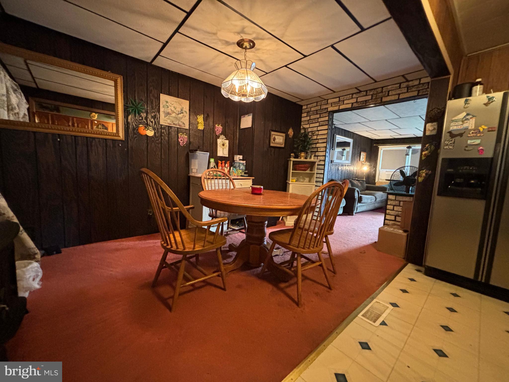 7552 Rabon Avenue Baltimore, MD 21222 - Photo 13 of 39 a view of a dining room with furniture and wooden floor