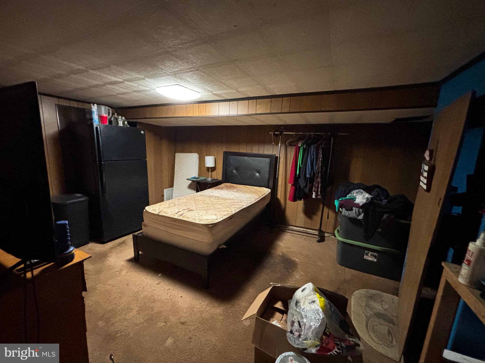 7552 Rabon Avenue Baltimore, MD 21222 - Photo 26 of 39 a bed room with a bed and a television
