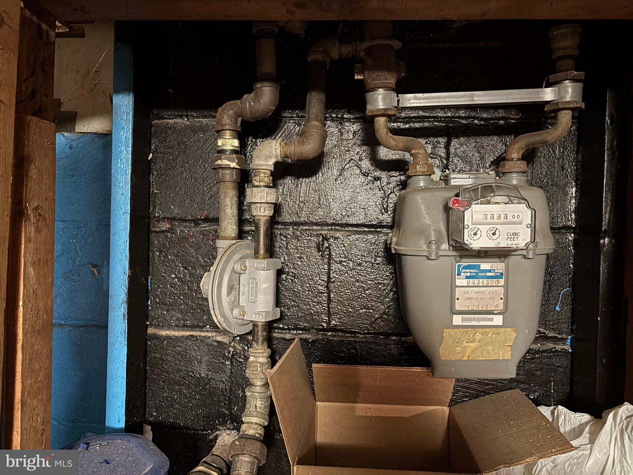 7552 Rabon Avenue Baltimore, MD 21222 - Photo 32 of 39 a room with water heater and utility racks