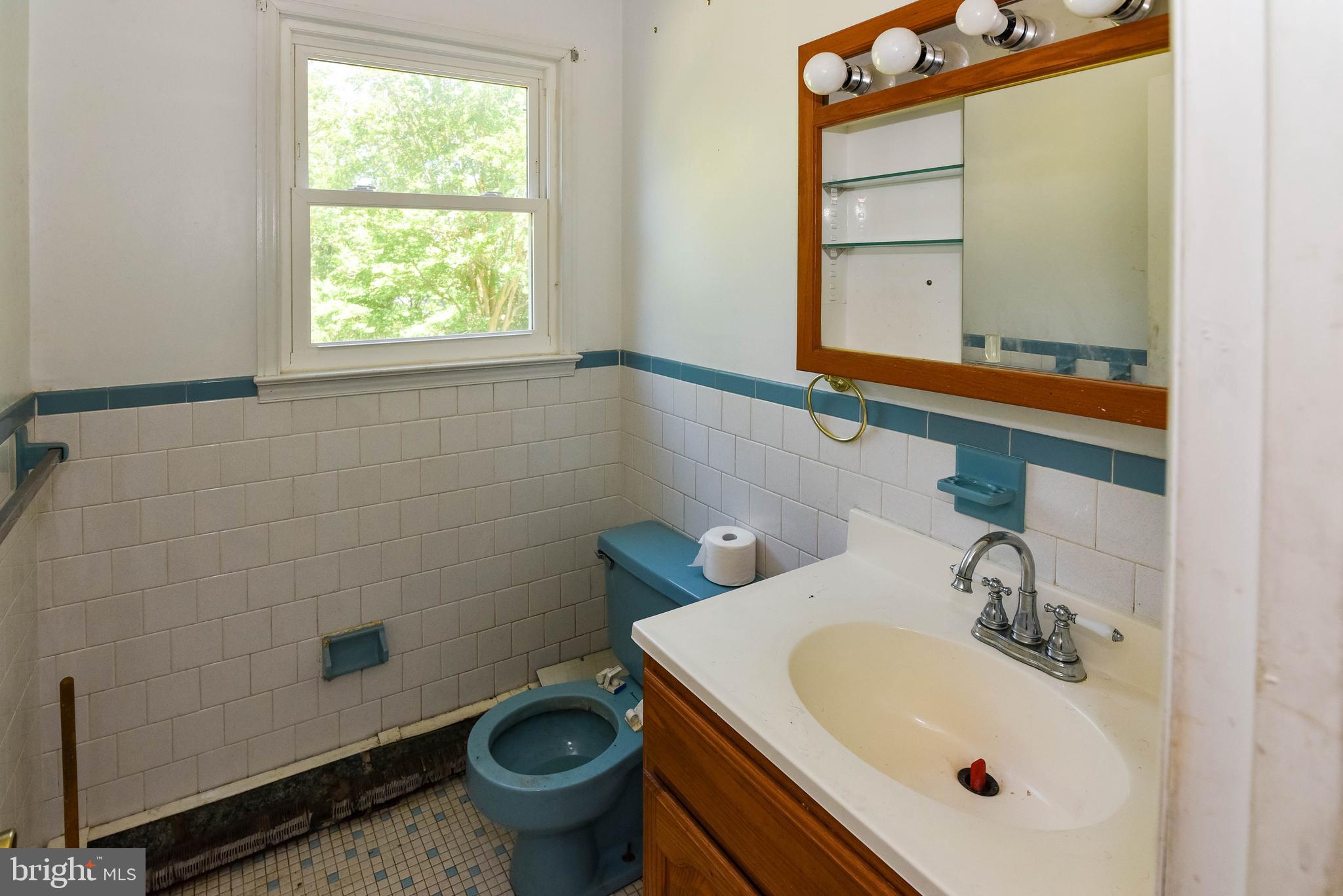 1204 Dicus Mill Road Millersville, MD 21108 - Photo 13 of 63 a bathroom with a sink and a toilet