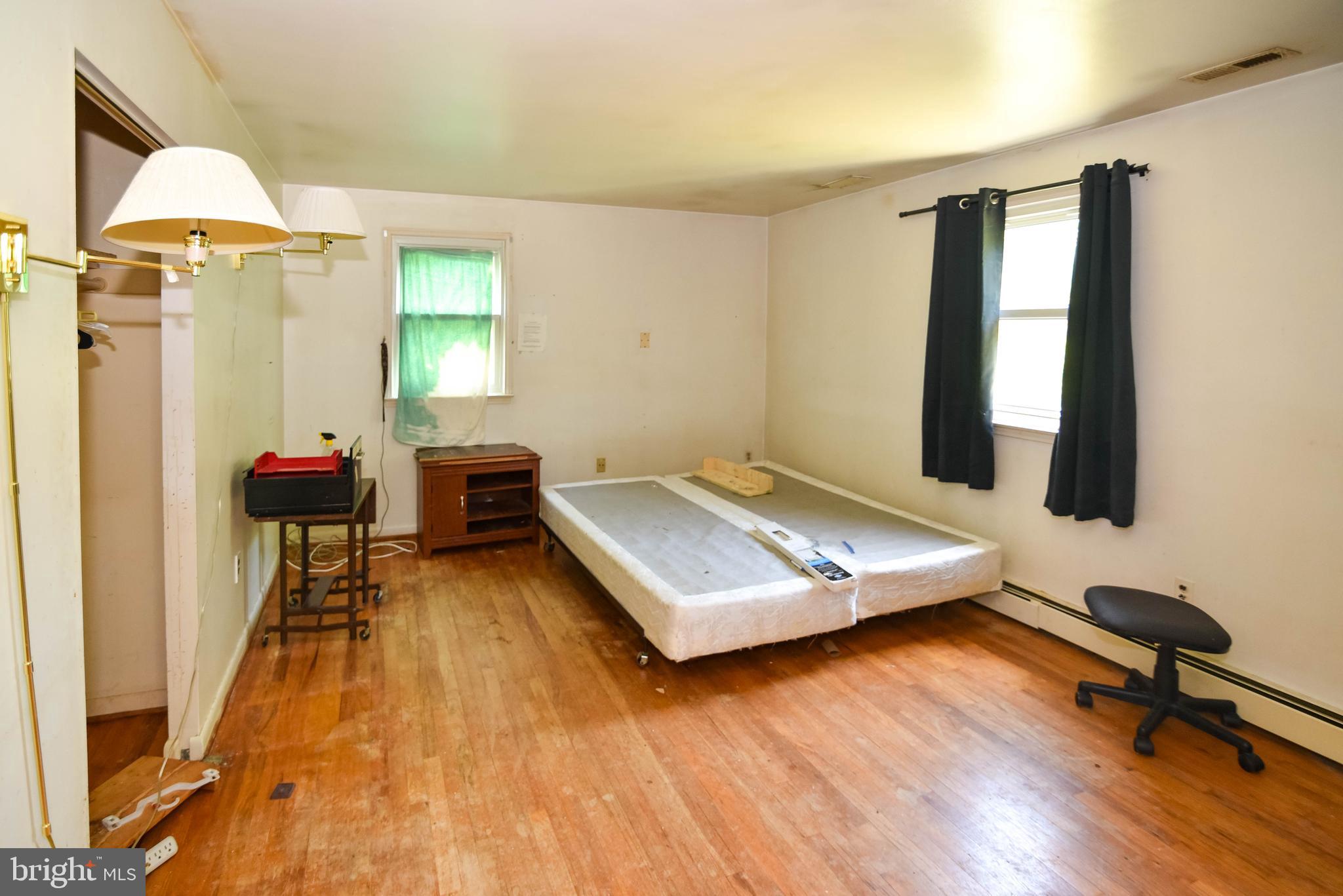 1204 Dicus Mill Road Millersville, MD 21108 - Photo 19 of 63 a room with gym equipment and a wooden floor