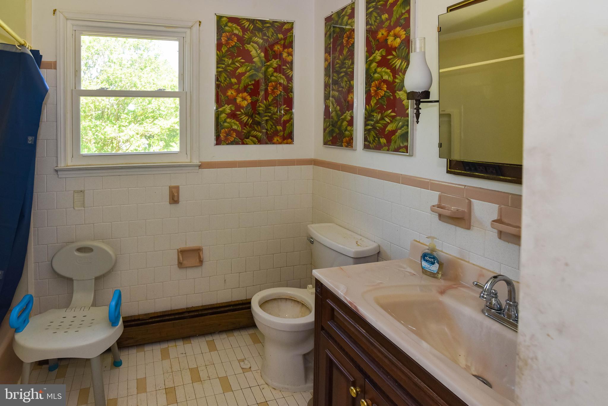 1204 Dicus Mill Road Millersville, MD 21108 - Photo 23 of 63 a bathroom with a sink toilet and window
