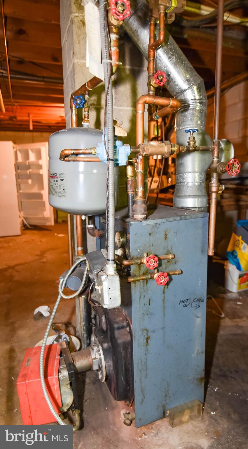1204 Dicus Mill Road Millersville, MD 21108 - Photo 43 of 63 a view of store room with water heater