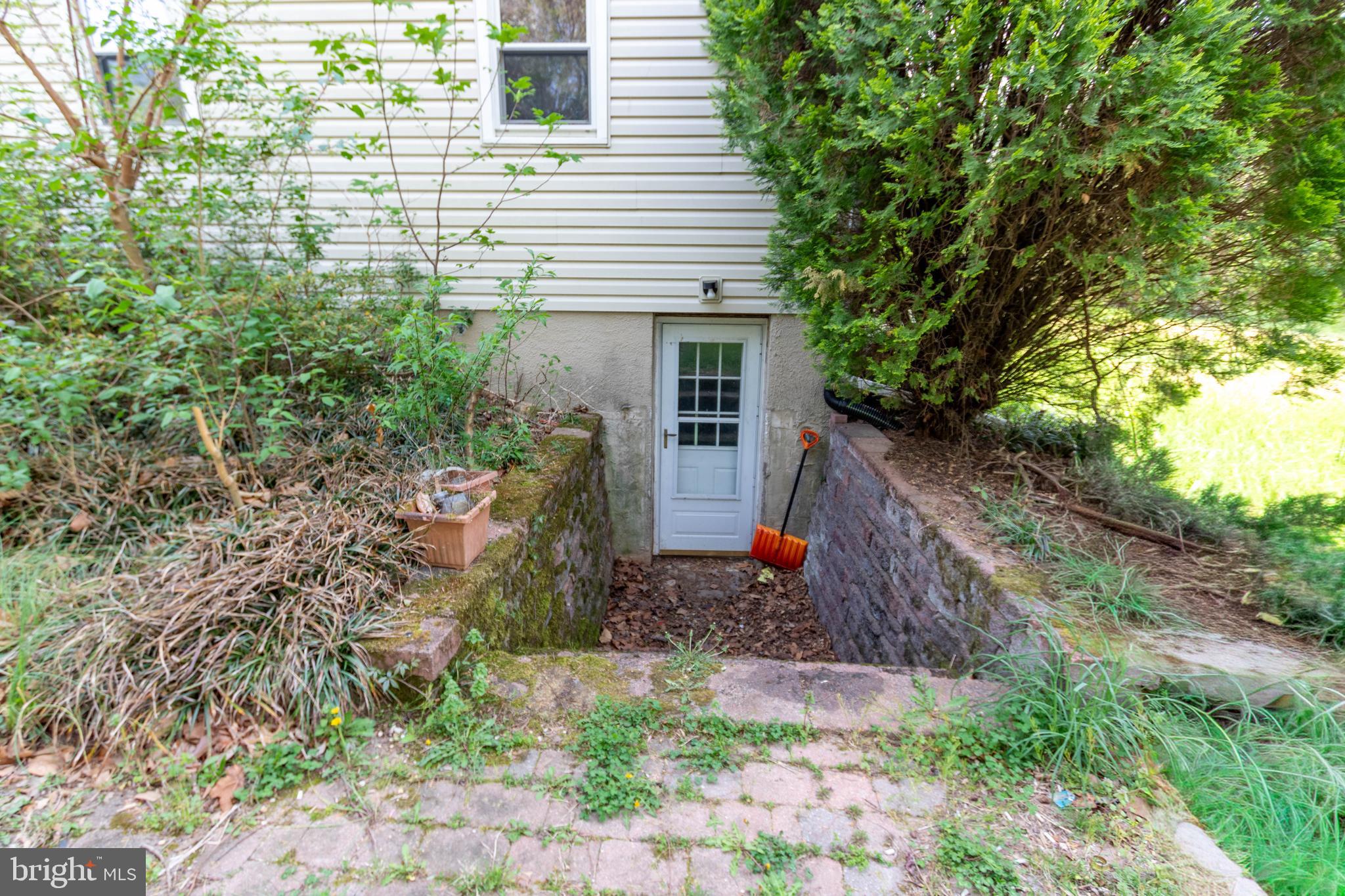1204 Dicus Mill Road Millersville, MD 21108 - Photo 47 of 63 a view of a house with a yard and plants