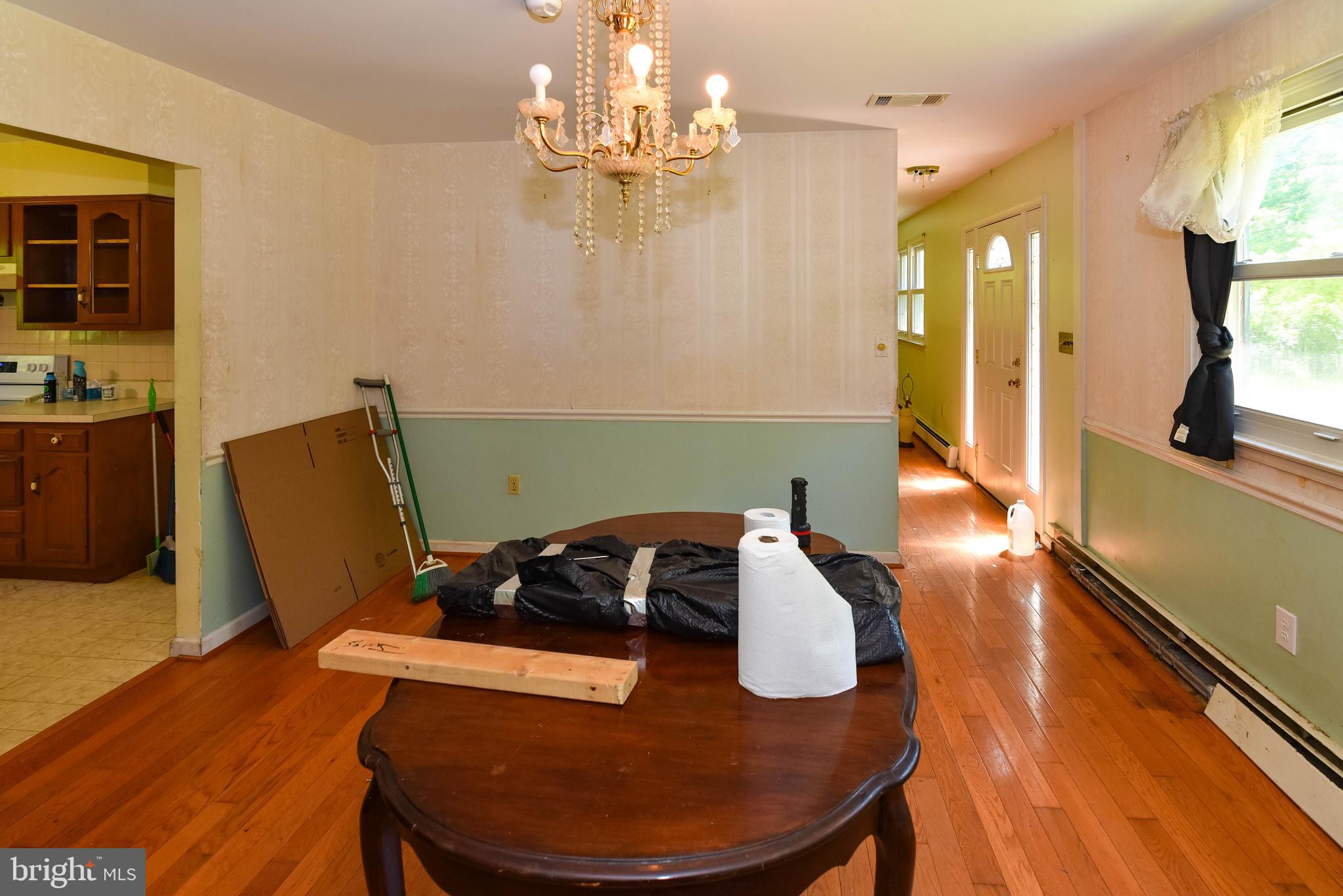 1204 Dicus Mill Road Millersville, MD 21108 - Photo 5 of 63 a living room with furniture and a chandelier