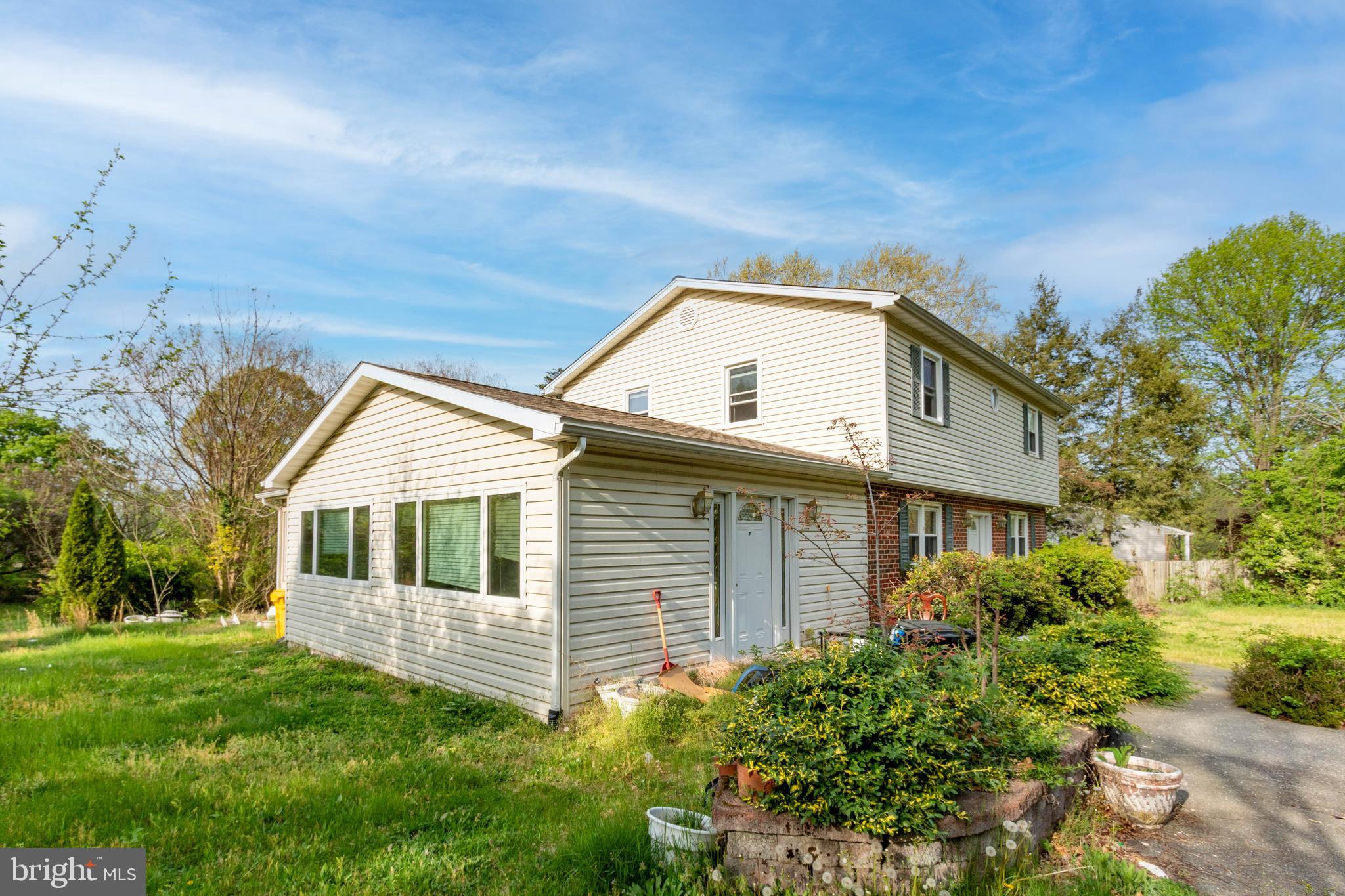 1204 Dicus Mill Road Millersville, MD 21108 - Photo 52 of 63 a front view of a house with a yard