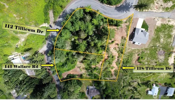 an aerial view of houses with yard