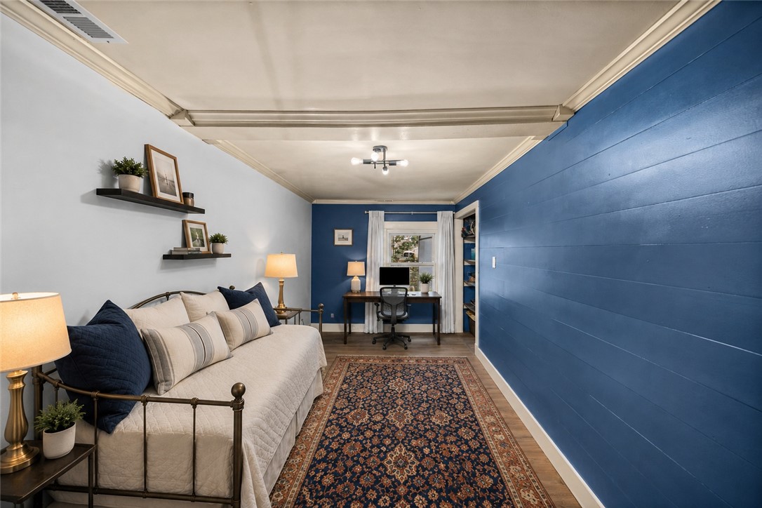 203 Muller Road Walhalla, SC 29691 - Photo 17 of 34 Crown molding and hardwood flooring highlight this versatile room configured with a dedicated workspace.