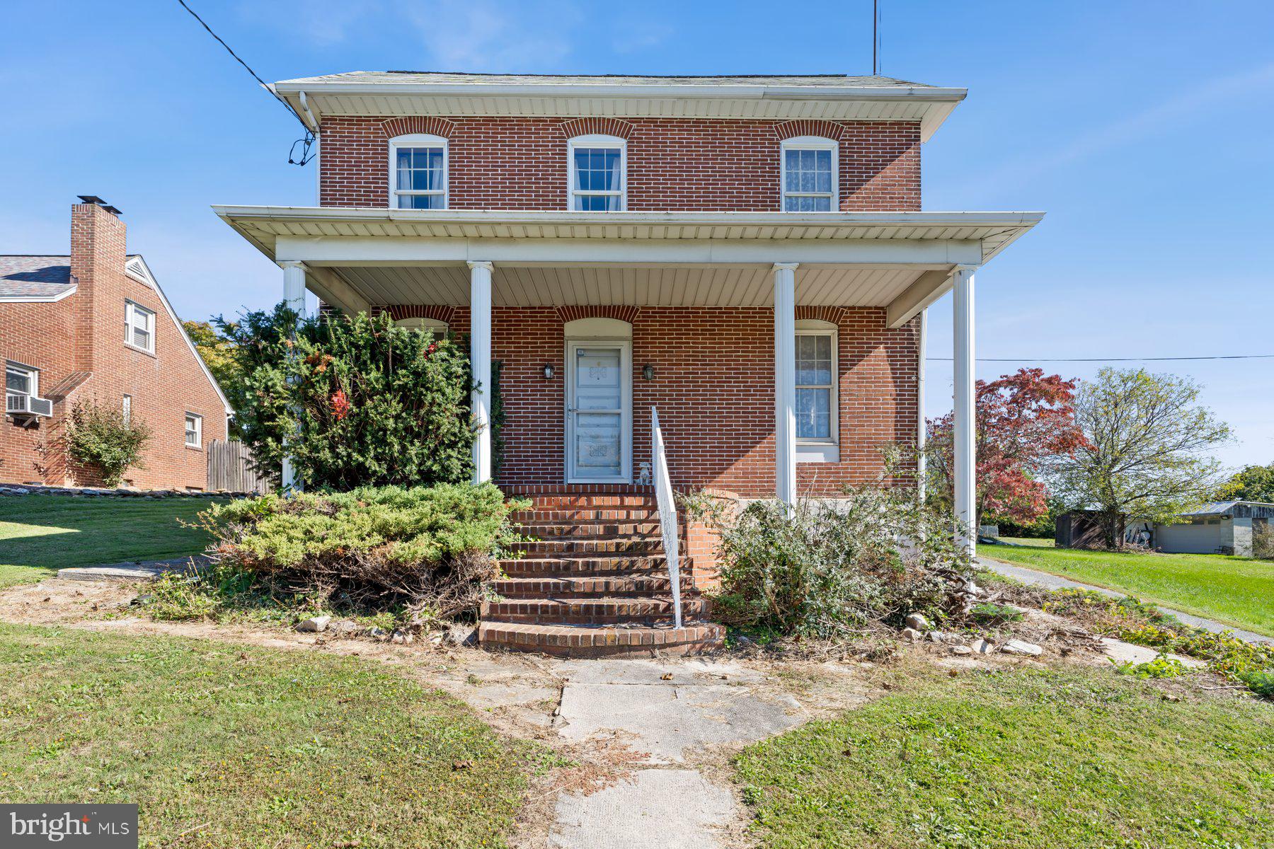 2943 Main Street Manchester, MD 21102 - Photo 1 of 43 a front view of a house with garden
