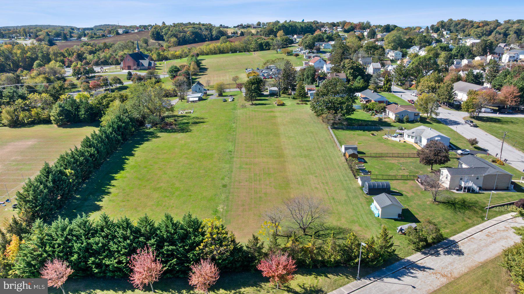 2943 Main Street Manchester, MD 21102 - Photo 11 of 43 an aerial view of residential houses with outdoor space and lake view