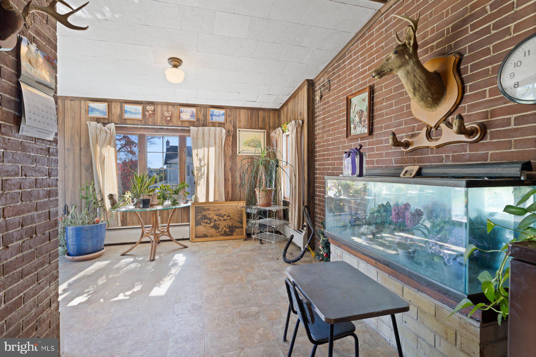 2943 Main Street Manchester, MD 21102 - Photo 17 of 43 a living room with furniture and a floor to ceiling window