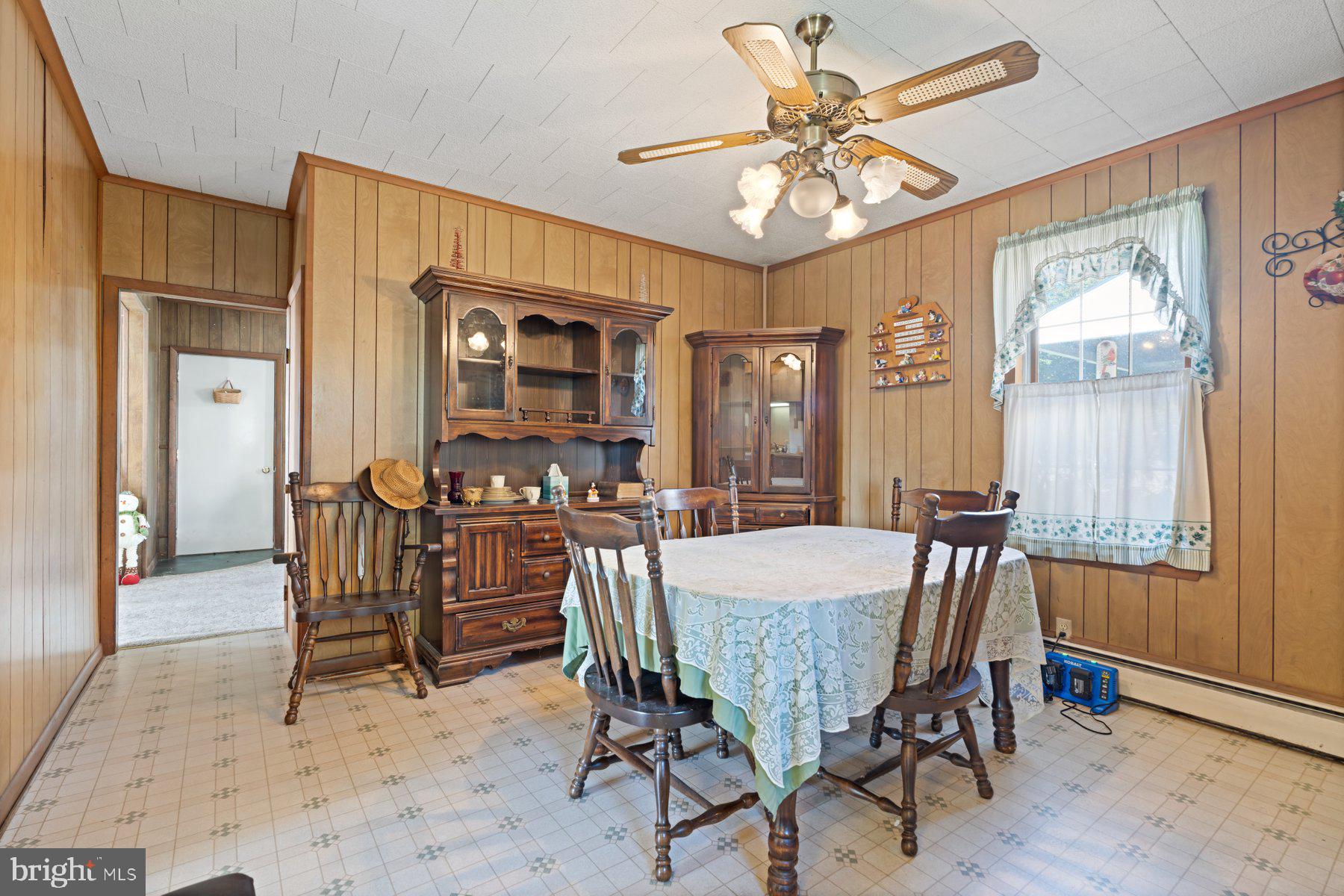 2943 Main Street Manchester, MD 21102 - Photo 20 of 43 a view of a dining room with furniture window and wooden floor