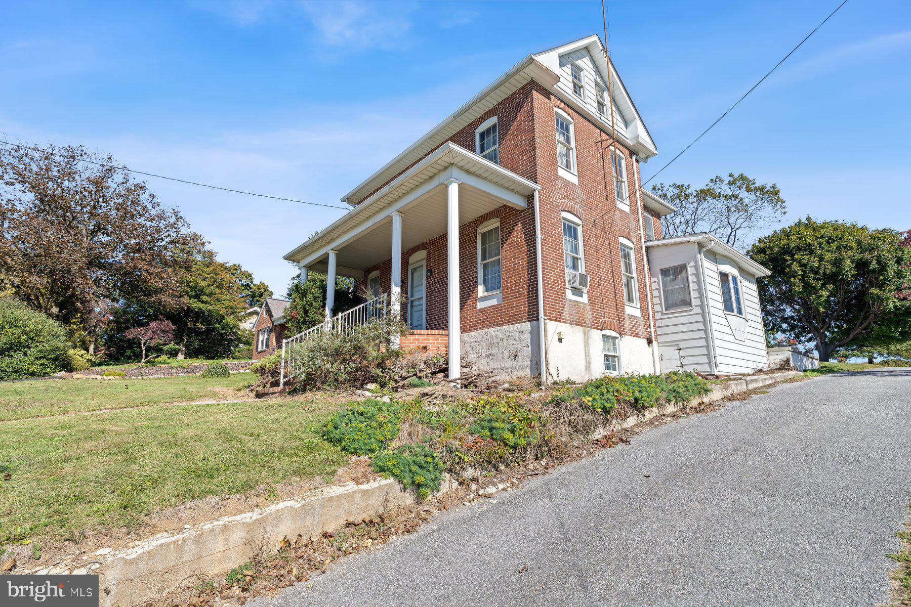 2943 Main Street Manchester, MD 21102 - Photo 2 of 43 front view of a house with a yard