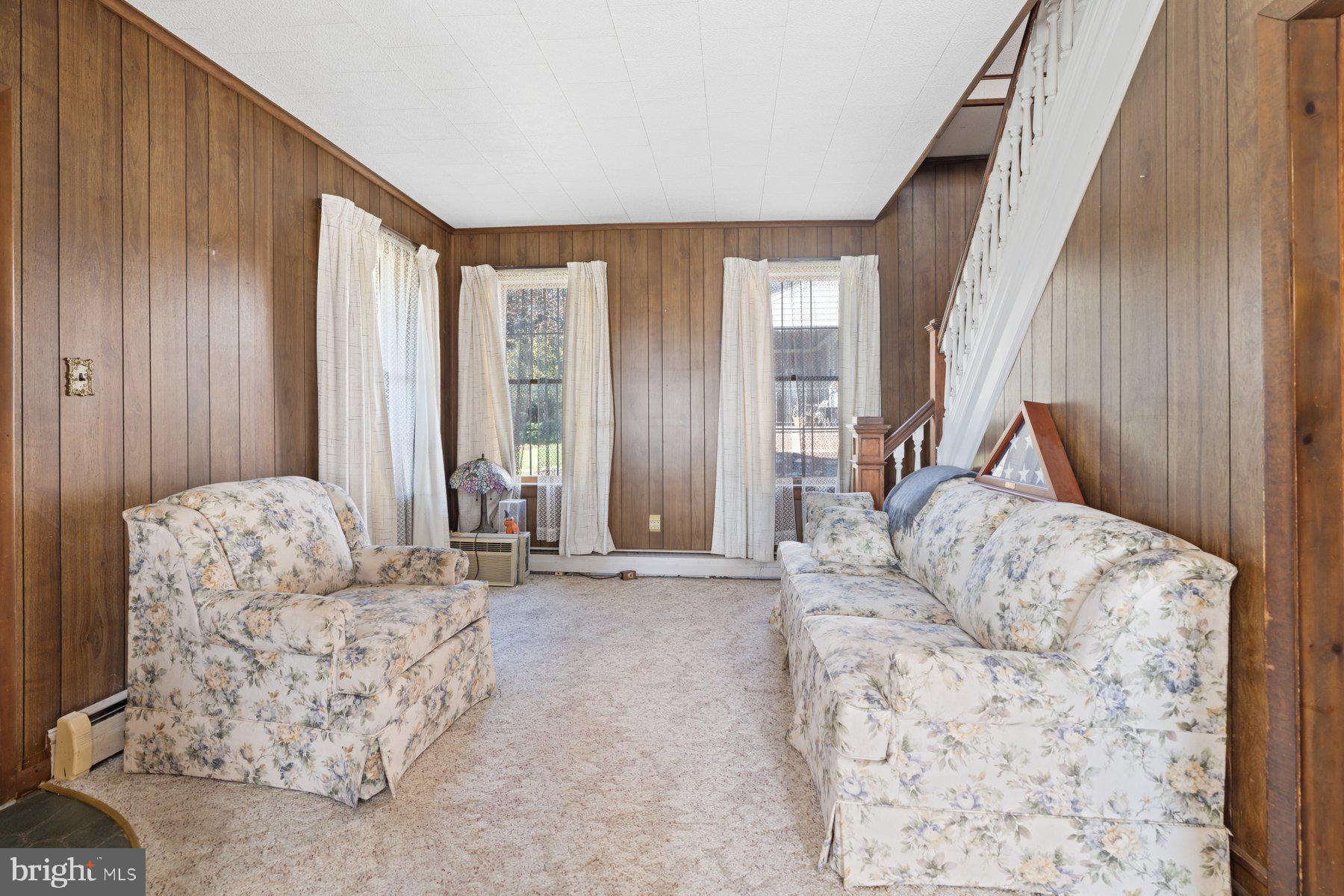 2943 Main Street Manchester, MD 21102 - Photo 25 of 43 a living room with furniture and a large window