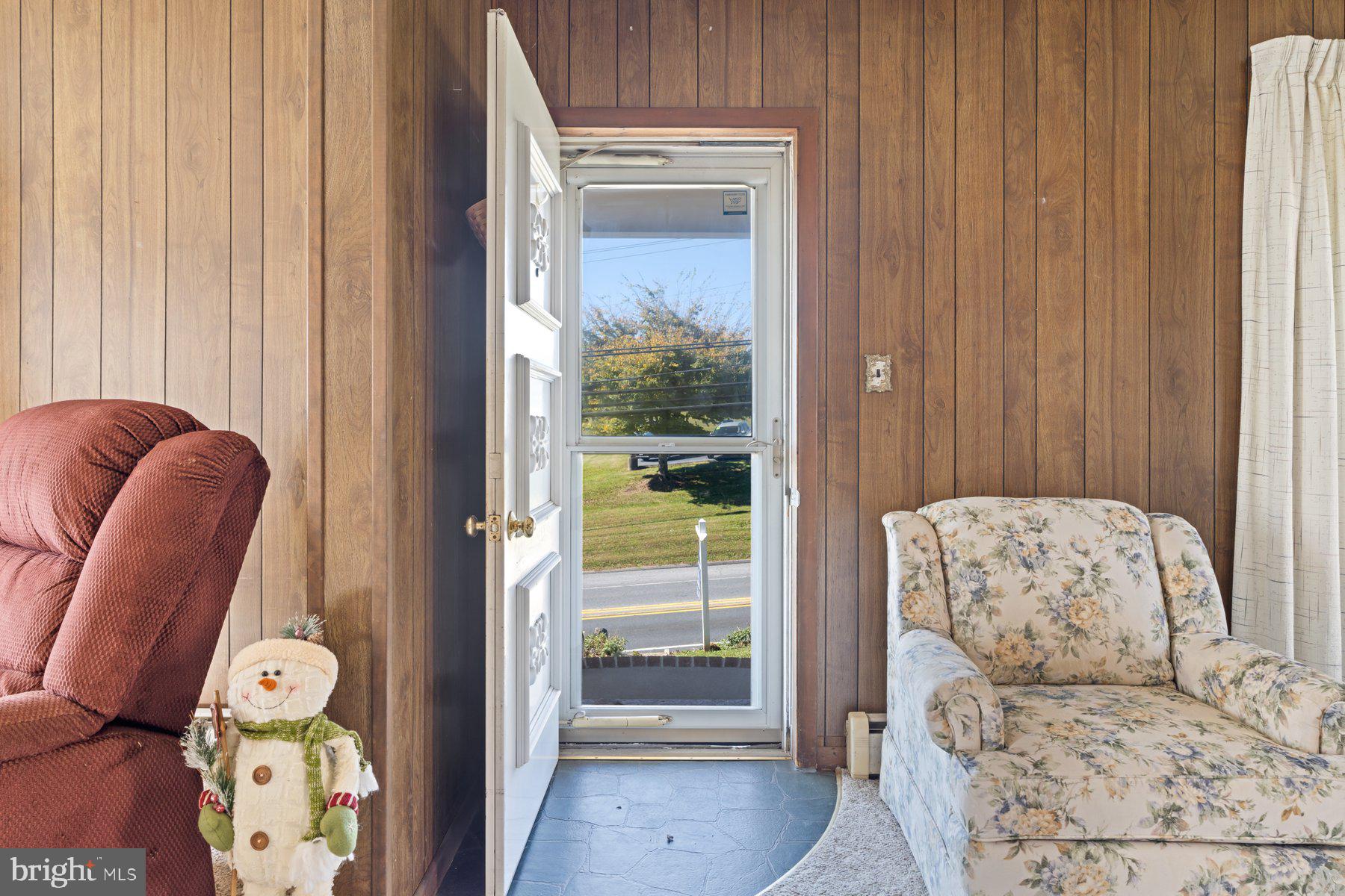 2943 Main Street Manchester, MD 21102 - Photo 26 of 43 a bedroom with a bed and a chandelier