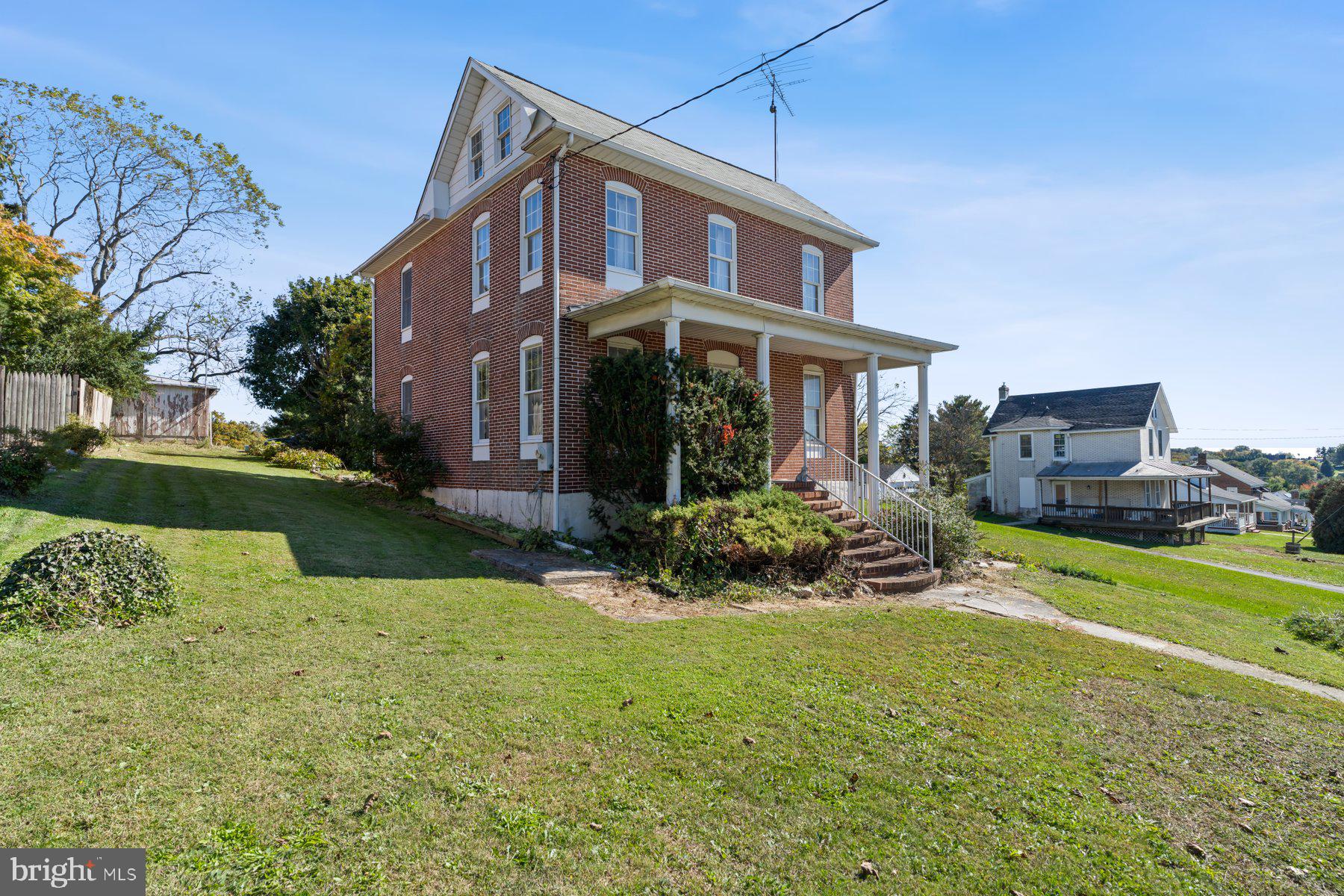 2943 Main Street Manchester, MD 21102 - Photo 3 of 43 a front view of a house with garden