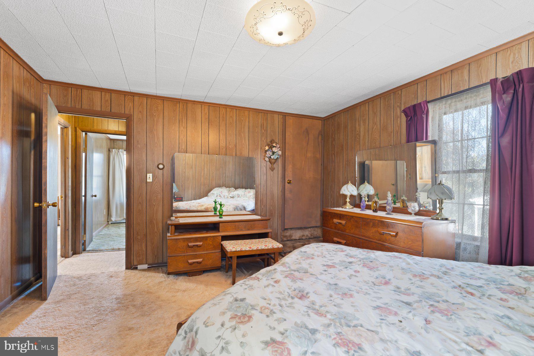 2943 Main Street Manchester, MD 21102 - Photo 31 of 43 a bedroom with a bed dresser and a large window