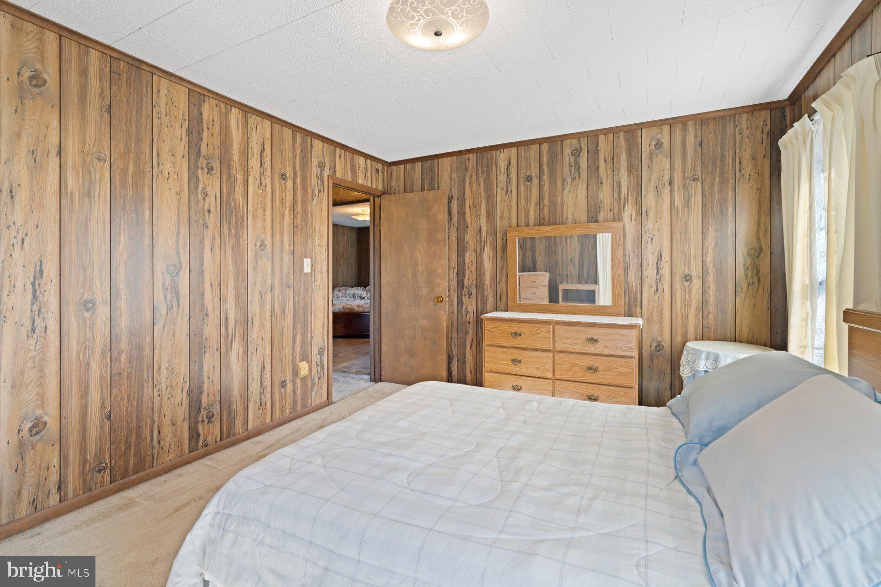 2943 Main Street Manchester, MD 21102 - Photo 36 of 43 a bedroom with a large bed and a window