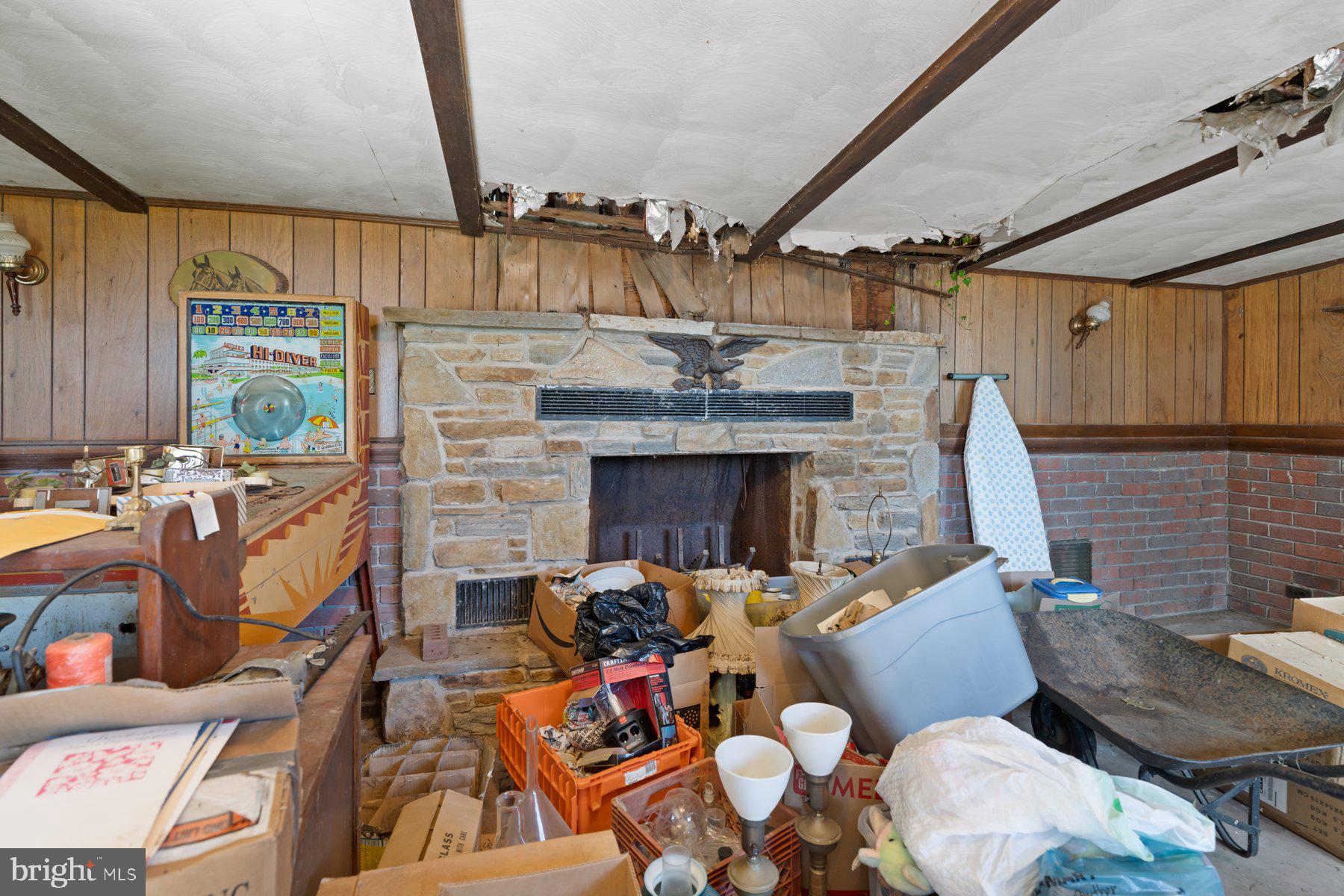 2943 Main Street Manchester, MD 21102 - Photo 40 of 43 a living room with furniture a fireplace and a flat screen tv