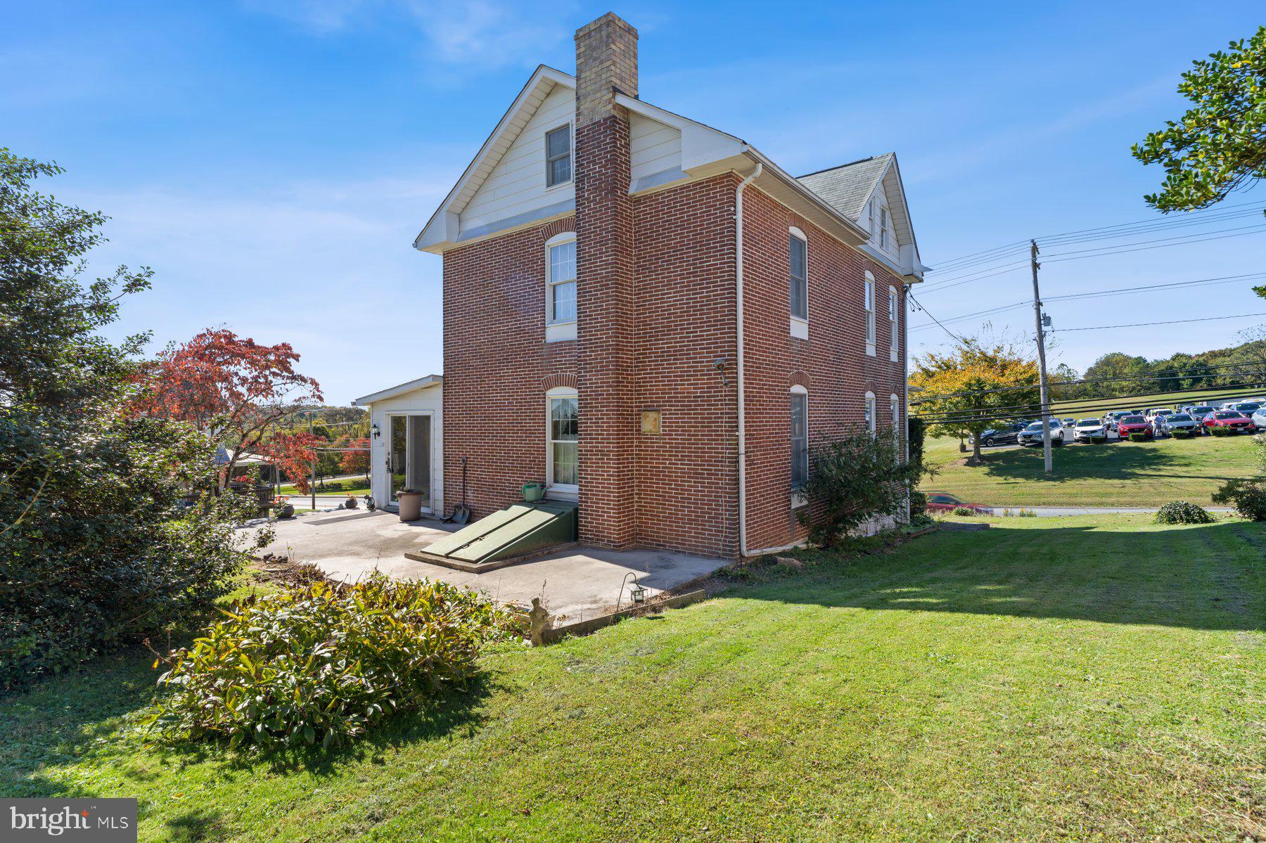 2943 Main Street Manchester, MD 21102 - Photo 4 of 43 a front view of a house with a yard and garage