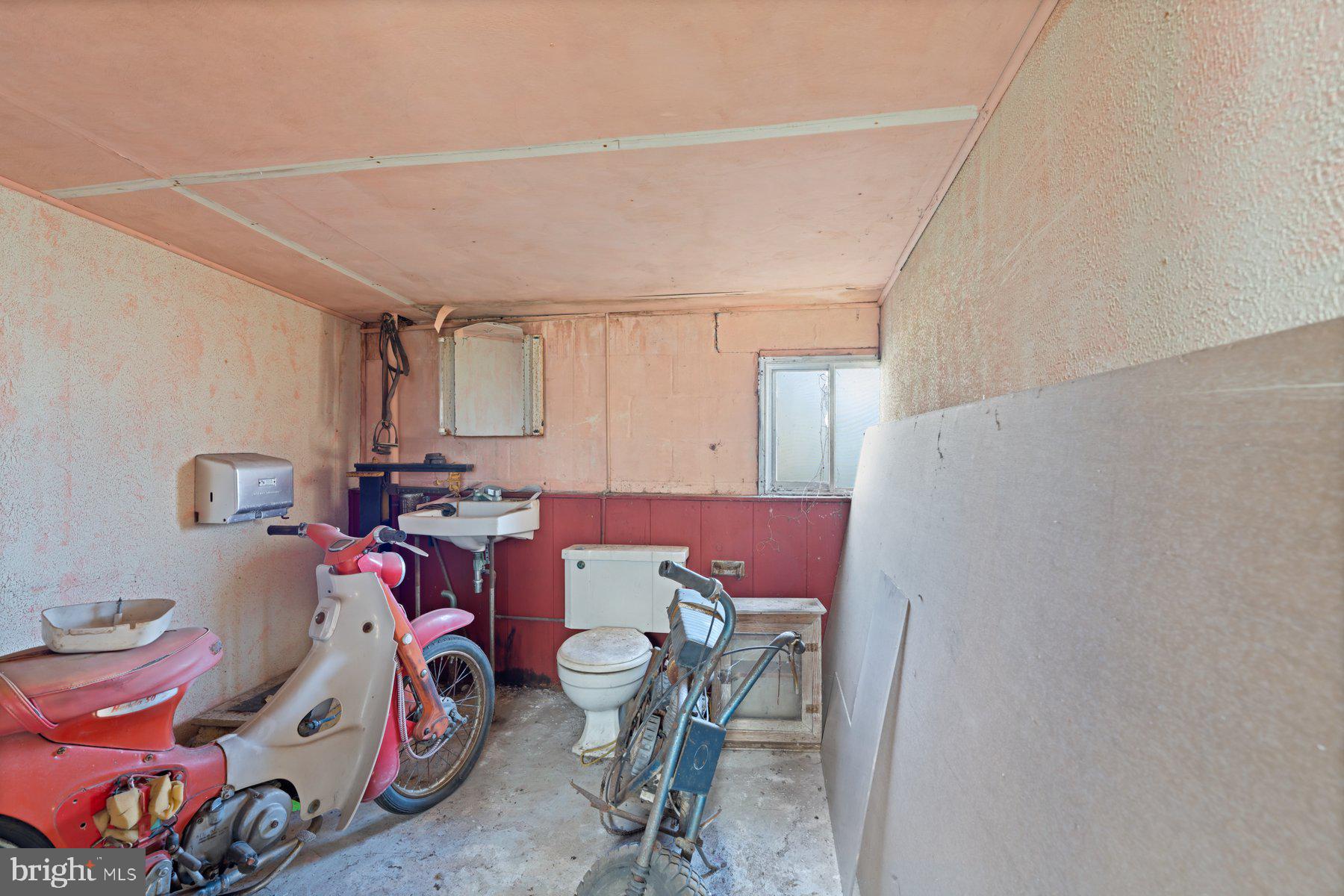 2943 Main Street Manchester, MD 21102 - Photo 41 of 43 a view of a room that has a bed and a chair in it
