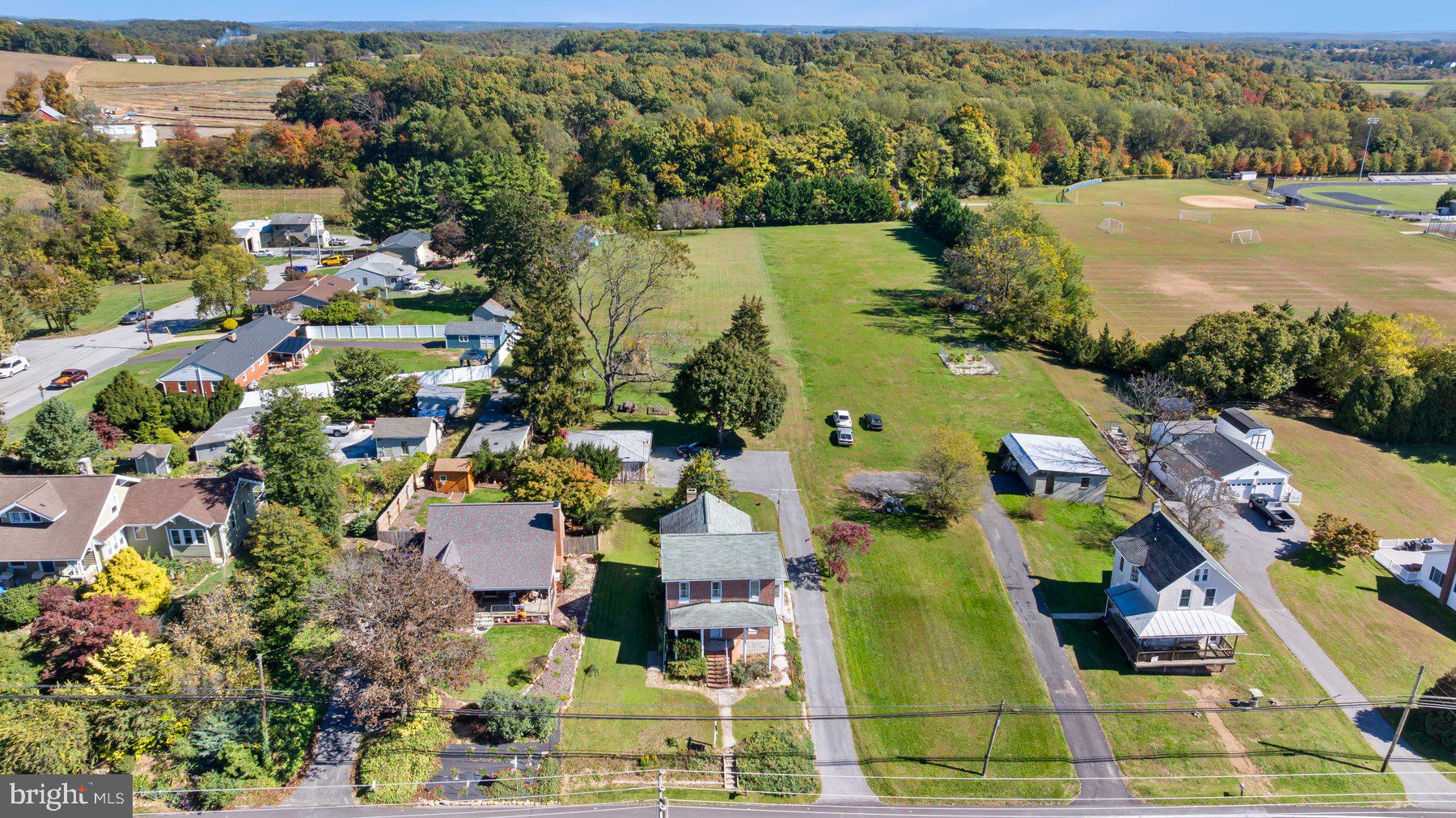 2943 Main Street Manchester, MD 21102 - Photo 6 of 43 an aerial view of residential houses with outdoor space