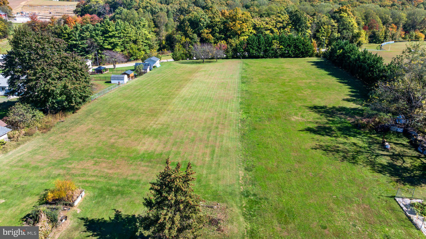 2943 Main Street Manchester, MD 21102 - Photo 10 of 43 a view of yard with swimming pool and seating space