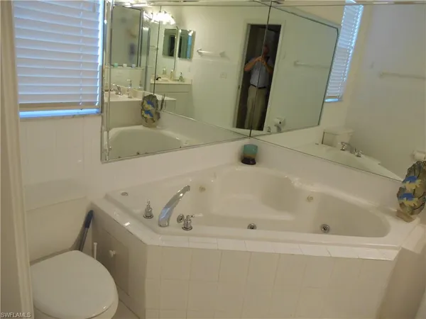 a bathroom with sink and mirror