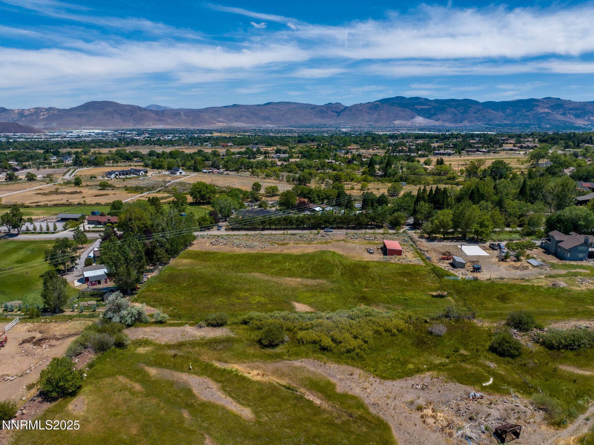 11355 Maverick Lane Reno, NV 89511 - Photo 5 of 14 a view of a city with mountains in the background