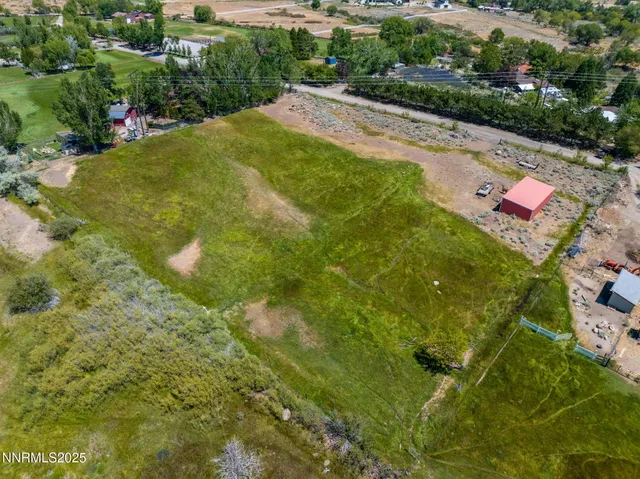 a view of a street with a yard