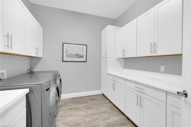 a kitchen with cabinets and window