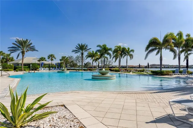 a view of a swimming pool and lounge chair