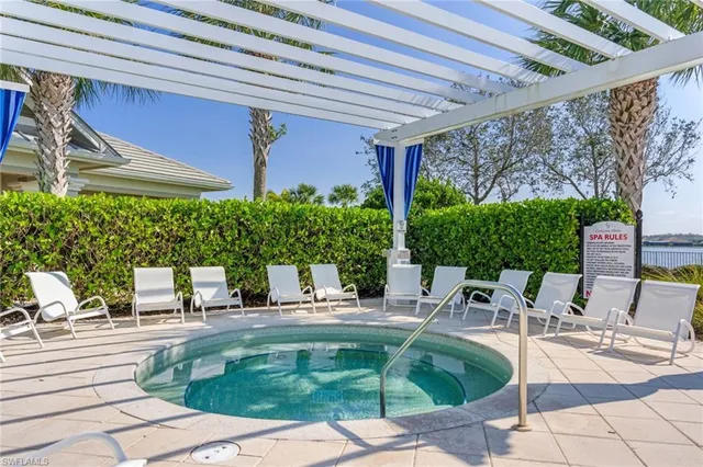 a building outdoor space with patio furniture and potted plants