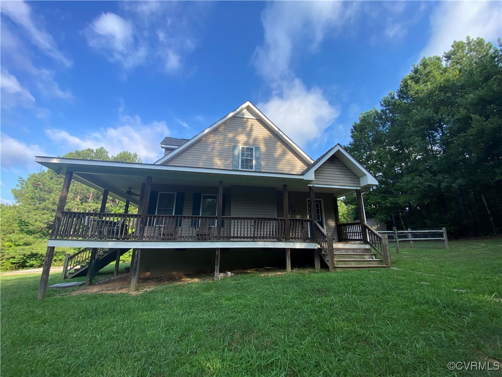 4554 Plank Road Kenbridge, VA 23944 - Photo 19 of 41 a front view of a house with a yard table and chairs