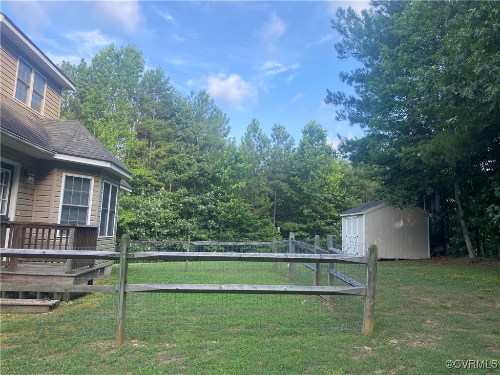 4554 Plank Road Kenbridge, VA 23944 - Photo 20 of 41 a view of a house with a backyard and a large tree
